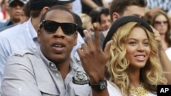 Rapper Jay-Z and his wife, singer Beyonce, attend the match between Novak Djokovic of Serbia and Rafael Nadal of Spain during the men's final of the U.S. Open tennis tournament in New York (file photo)