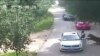 This video frame grab received from China's state broadcaster CCTV on July 25, 2016, shows a tiger (far R) attacking a passenger after she stepped out a car at Beijing Badaling Wildlife World on July 23, 2016.