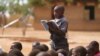 ARCHIVES - Un garçon lit à haute voix lors d'une visite de Melania Trump, alors première dame des États-Unis, à l'école primaire de Chipala, à Lilongwe, au Malawi, le 4 octobre 2018.