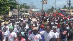FILE - Anti-corruption protesters fill the streets of Port-au-Prince, Haiti, June 9, 2019.
