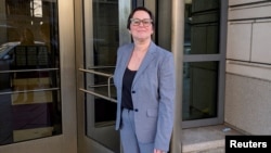 FILE - Cathy Harris of the U.S. Merit Systems Protection Board leaves the E. Barrett Prettyman U.S. Courthouse in downtown Washington, March 3, 2025.