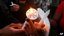 Supporters light candles during a vigil for 15-year-old Jordan Edwards in Balch Springs, Texas, May 4, 2017. Edwards was killed leaving an unruly house party Saturday night when former police officer Roy Oliver opened fired on the car Edwards was a passenger in. Oliver was fired Tuesday for violating department policies. 