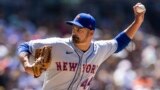 FILE - New York Mets' T.J. McFarland (a left-hander) winds up against the San Diego Padres in the sixth inning of a baseball game Sunday, July 9, 2023, in San Diego.(AP Photo/Derrick Tuskan, File)