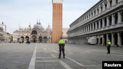 The almost empty St. Mark?s Square is seen after the Italian government imposed a virtual lockdown on the north of Italy including Venice to try to contain a coronavirus outbreak, in Venice, Italy, March 9, 2020. REUTERS/Manuel Silvestri.