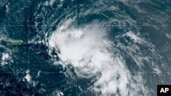 This satellite image released by the National Oceanic and Atmospheric Administration (NOAA) shows Tropical Storm Laura in the North Atlantic Ocean, Friday, Aug. 21, 2020. Laura formed Friday in the eastern Caribbean and forecasters said it poses a…