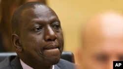 FILE - Kenya's Deputy President William Ruto awaits the start of his trial, Sept. 10, 2013.