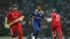 Sri Lankan bowler Nuwan Kulasekara, center, runs along with Zimbabwe's batsmen Brendan Taylor, left, and Regis Chakabva during the Cricket World Cup match between Sri Lanka and Zimbabwe in Pallekele, Sri Lanka, Thursday, March 10, 2011. (AP Photo/Eranga J