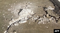 This UGC photo taken and posted by Jonathan Guliban on Facebook on Jan. 23, 2025 shows cracked pavement of a highway in Liloan town, Southern Leyte province, after a 5.8 earthquake hit the province.