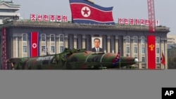 North Korean vehicle carrying a missile passes by during a mass military parade to celebrate the centenary of the birth of late N. Korean founder Kim Il Sung, April 15, 2012.