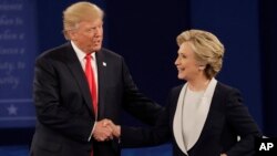 Republican presidential nominee Donald Trump shakes hands with Democratic presidential nominee Hillary Clinton following the second presidential debate at Washington University in St. Louis, Oct. 9, 2016. 