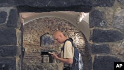 A tourist visits the St. Ananias church, dating back to the first century, in Damascus June 3, 2010 (file photo)