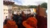 Tibetan protesters in Denma give the thumbs up sign during a protest in August.