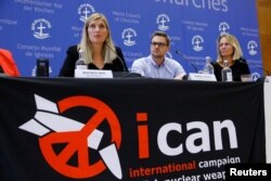 FILE - Beatrice Fihn, executive director of the International Campaign to Abolish Nuclear Weapons (ICAN), and other members of the organization attend a news conference after ICAN won the Nobel Peace Prize 2017, in Geneva, Switzerland, Oct. 6, 2017.