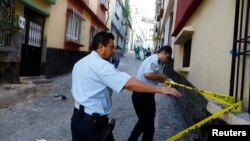 FILE - Police officers secure the scene of an explosion where a suspected suicide bomber targeted a wedding celebration in Gaziantep, Turkey, August 21, 2016.