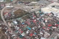 This handout photo taken and received from the Philippine Coast Guard on November 2, 2020 shows an aerial view of damaged buildings on the island province of Catanduanes, in the aftermath of Typhoon Goni.