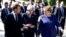 German Chancellor Angela Merkel, right, speaks with French President Emmanuel Macron, left, and British Prime Minister Theresa May after meeting at a hotel on the sidelines of an EU-Western Balkans summit in Sofia, Bulgaria, May 17, 2018. 