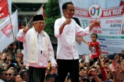 Presiden Joko Widodo dan Wakil Presiden Ma'ruf Amin ketika melakukan kampanye saat Pemilihan Presiden di Tangerang, Banten, 7 April 2019. (Foto : REUTERS/Willy Kurniawan)