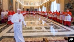 Pope Francis arrives in the Apostolic Palace for a meeting with cardinals to formally set a date for a saint-making Mass, at the Vatican, April 20, 2017.
