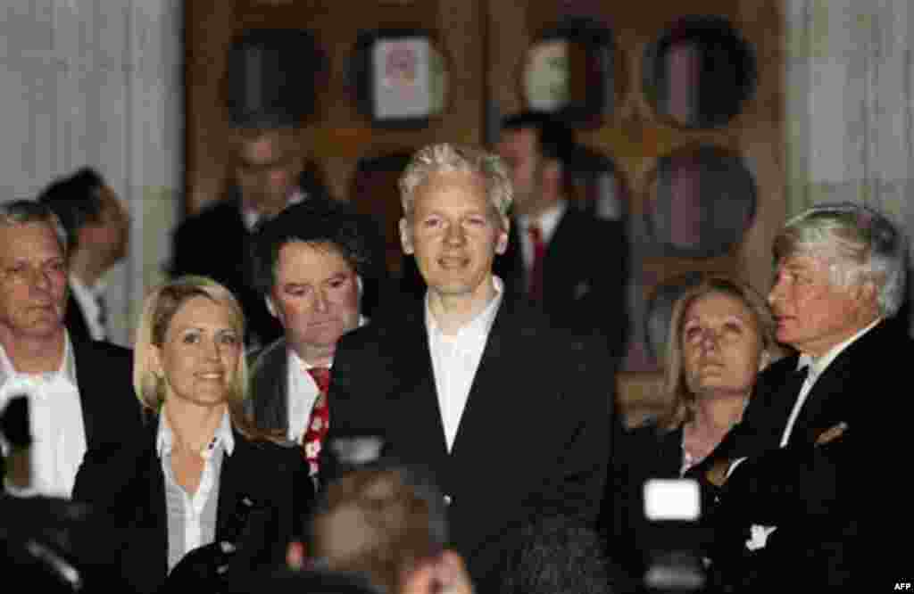 WikiLeaks founder Julian Assange, center, addresses the media after he was released on bail, outside the High Court, London, Thursday, Dec. 16, 2010. WikiLeaks founder Julian Assange has been released on bail following a week of legal drama over his extra