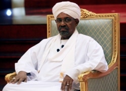 FILE - Former Sudanese President Omar al-Bashir addresses the National Dialogue Committee meeting at the Presidential Palace in Khartoum, Sudan, April 5, 2019.