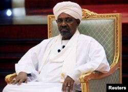 FILE - Then-Sudanese President Omar al-Bashir addresses the National Dialogue Committee meeting at the Presidential Palace in Khartoum, Sudan, April 5, 2019.