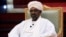 FILE - Then-Sudanese President Omar al-Bashir addresses the National Dialogue Committee meeting at the Presidential Palace in Khartoum, Sudan, April 5, 2019.