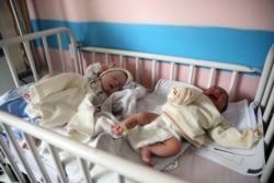 Newborn babies lie in their beds at the Ataturk Children's Hospital a day after they were rescued from a deadly attack on another maternity hospital, in Kabul, Afghanistan, May 13, 2020.