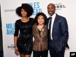 Don Cheadle, right, the star, director and co-screenwriter of "Miles Ahead," poses with Frances Davis, center, ex-wife of legendary jazz trumpeter Miles Davis, and cast member Emayatzy Corinealdi at the premiere of the film at the Writers Guild Theatre in