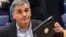 FILE - Greece's Finance Minister Euclid Tsakalotos prepares for a Eurogroup meeting at the EU Council in Luxembourg, Oct. 10, 2016. 