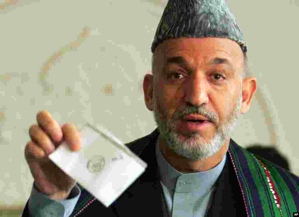 January, 4, 2004 -- A loya jirga adopts a new Afghan constitution. The move marks a major step toward holding the country's first free elections in more than two decades. In October, Mr. Karzai becomes the country's first democratically elected president,