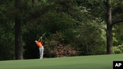 Amateur Guan Tianlang, of China, hits off the second hole during the second round of the Masters golf tournament in Augusta, Georgia, April 12, 2013.