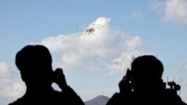 People take pictures of the 