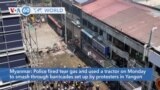 VOA60 World - Myanmar: Police fire tear gas and use a tractor to smash through barricades set up by protesters