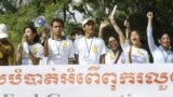 Social activists carry an anti-corruption banner during a rally in Phnom Penh, Cambodia.