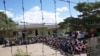 FILE—Prisoners gather inside Chikurubi Maximum prison before their release on the outskirts of the capital Harare, April 18, 2024.