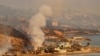 FILE - In this aerial view taken from a helicopter, homes burn on Pacific Coast Highway during the Palisades fire in Malibu, California, on January 9, 2025.