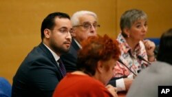 Former President Macron's security aide Alexandre Benalla (L) appears before the French Senate Laws Commission prior to his hearing, in Paris, France, Sept. 19, 2018.