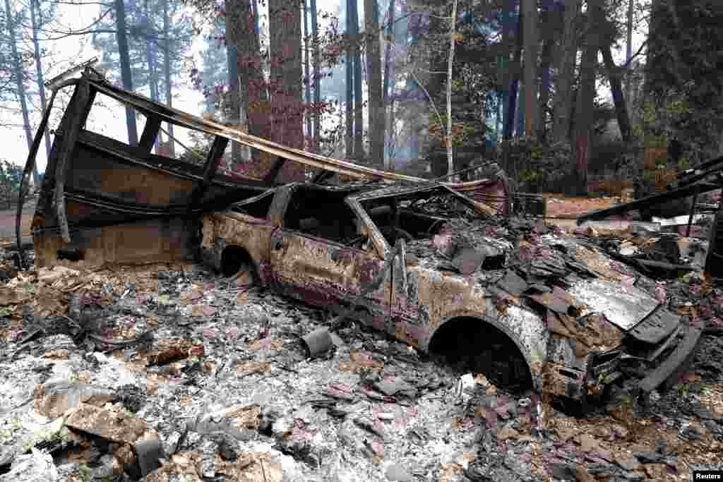 A car destroyed by the Camp Fire is seen in Paradise, California, Nov. 13, 2018. 