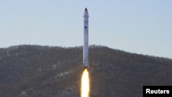 View of what appears to be a test related to the development of a reconnaissance satellite in this undated photo released by KCNA