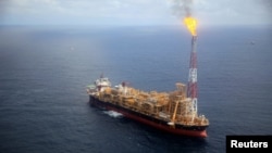 FILE:
Kaombo Norte floating oil platform is seen from a helicopter off the coast of Angola, Nov. 8, 2018. 