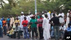 After casting their ballots earlier this month, voters in Abuja await the results. Election officials have asked voters to await the results at the stations to help ensure there's no tampering. The presidential vote is set for Saturday, April 16.