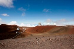 FILE - Observatories and telescopes sit atop Mauna Kea, Hawaii's tallest mountain and designated construction site for a new $1.4 billion telescope, near Hilo, Hawaii, Aug. 31, 2015.