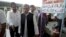Pakistan's Railway Minister Haji Ghulam Ahmad Bilour, center, arrives at the Attari railway station on the Samjhauta Express train near Amritsar, India, May 19, 2011.