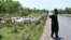 FILE - A fulani herder watches his cows near Ouangolodougou, northern Ivory Coast, close to the Burkina Faso and Mali borders, June 24, 2020. 