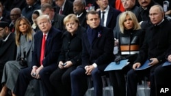 U.S President Donald Trump, second left, and first lady Melania Trump, left, German Chancellor Angela Merkel, third left, French