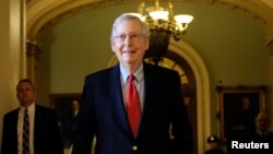 U.S. Senate Majority Leader Mitch McConnell (R-KY) leaves the Senate floor during debate over the Republican tax reform plan in Washington, Dec. 1, 2017.