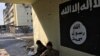 FILE - An Islamic State flag is seen on a the wall at Salam Hospital before it was removed by Iraqi forces, in Mosul, Iraq, Jan. 12, 2017. (K. Omar/VOA Kurdish)