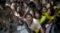 Indian policewomen detain Tibetan youth activists during a protest to highlight Chinese control over Tibet, outside the Hyderbad House in New Delhi, India, Sept. 18, 2014. 