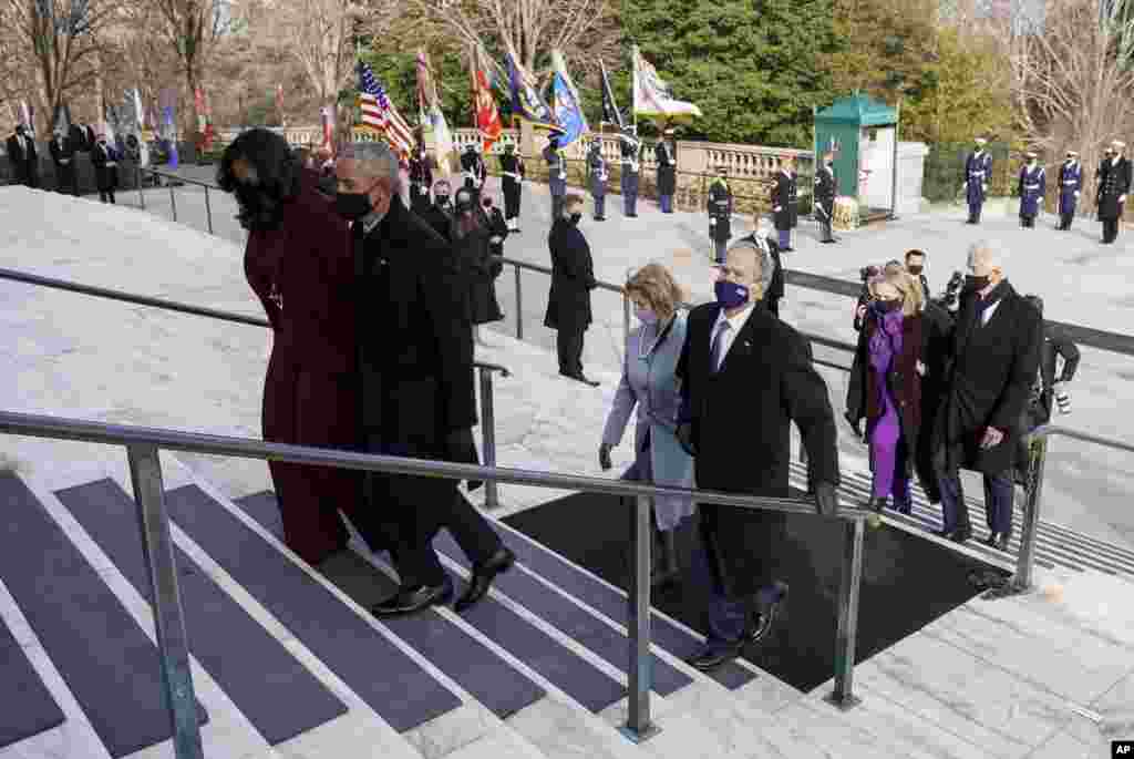 Former President Bill Clinton and former Secretary of State Hillary Clinton, right, former President George W. Bush and former first lady Laura Bush, center and former President Barack Obama and former first lady Michelle Obama, walk after President Joe Biden and Vice President Kamala Harris placed a wreath at the Tomb of the Unknown Soldier at the Arlington National Cemetery, in Arlington, Va., Wednesday, Jan. 21, 2021. (Joshua Roberts/Pool photo via AP)
