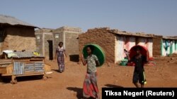 FILE: Eritrean refugee children walk inside the Mai-Aini refugee camp near the border with Eritrea in Ethiopia's Tigrai region on February 10, 2016.